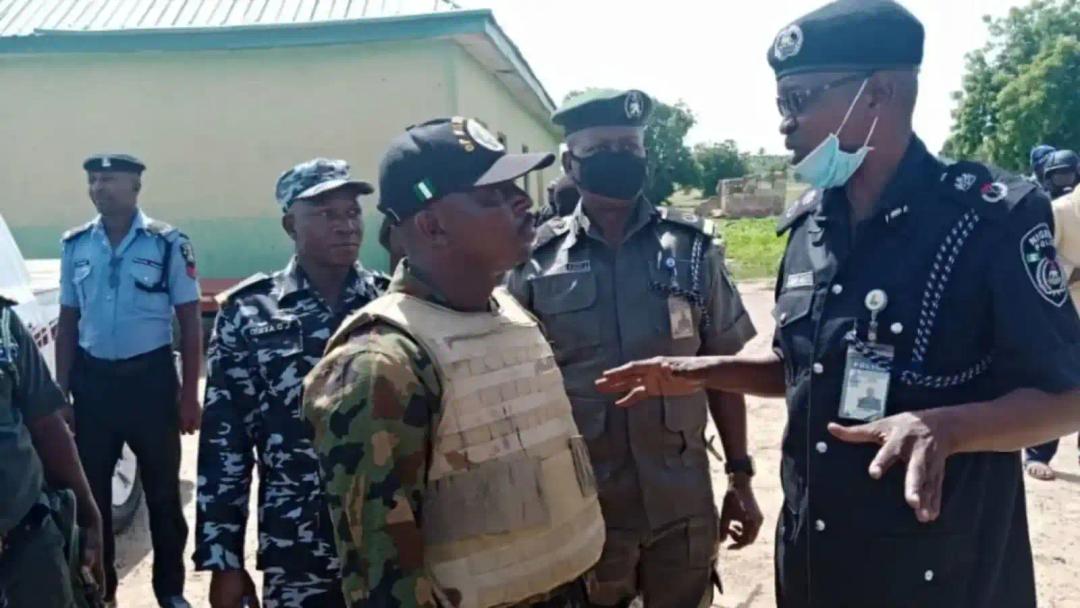 police and soldiers clash